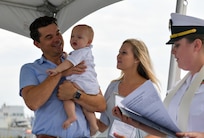 NAVAL STATION NORFOLK (Aug. 5, 2022) Family members celebrate Blaze Michael Laboon’s bell baptism aboard the guided-missile destroyer USS Laboon (DDG 58). Lt. Alisa L. Harl, chaplain aboard Laboon baptize Blaze Michael Laboon, the great-great-grandnephew of Laboon’s namesake. (U.S. Navy photo by Mass Communication Specialist 1st Class Jacob Milham)