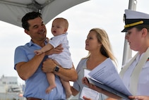 NAVAL STATION NORFOLK (Aug. 5, 2022) Family members celebrate Blaze Michael Laboon’s bell baptism aboard the guided-missile destroyer USS Laboon (DDG 58). Lt. Alisa L. Harl, chaplain aboard Laboon baptize Blaze Michael Laboon, the great-great-grandnephew of Laboon’s namesake. (U.S. Navy photo by Mass Communication Specialist 1st Class Jacob Milham)