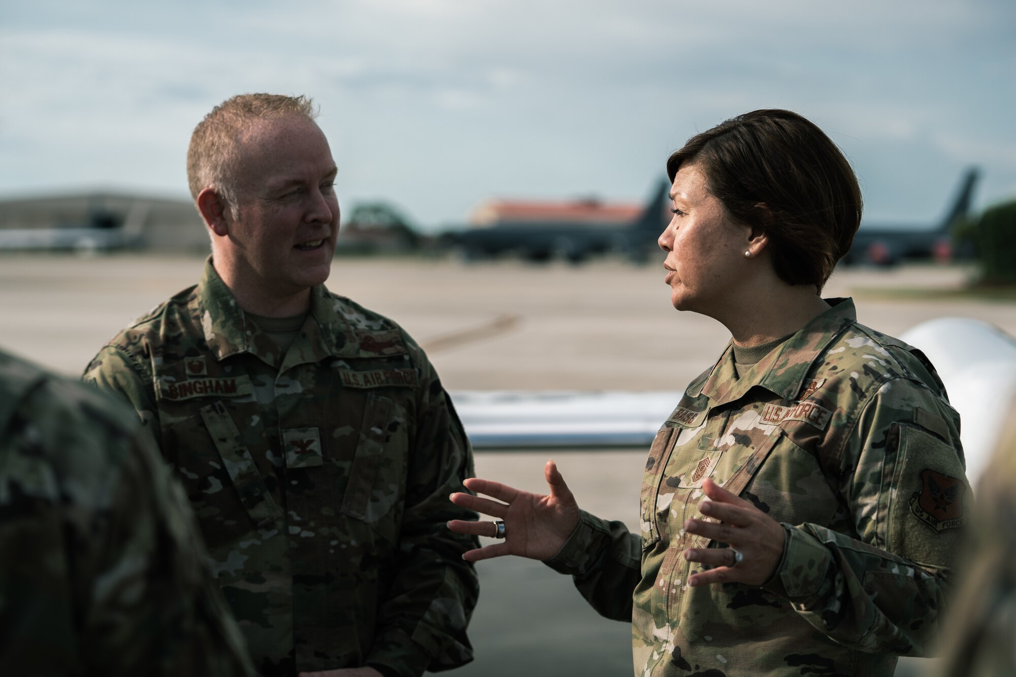 Chief Master Sgt. of the Air Force JoAnne S. Bass speaks with Col. Adam Bingham, 6th Air Refueling Wing commander, on the flight line at MacDill Air Force Base, Florida, Aug. 3, 2022.