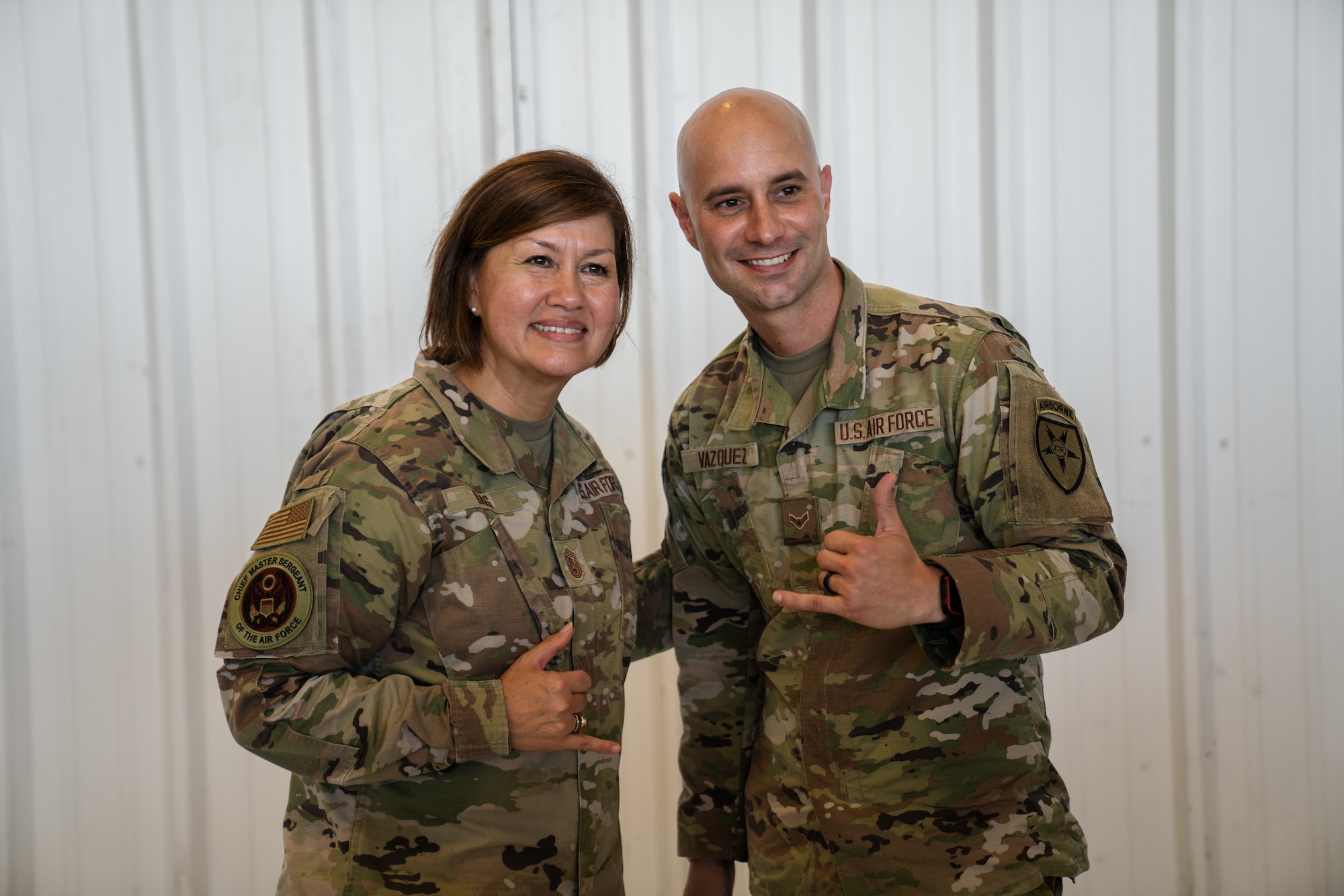 Chief Master Sgt. of the Air Force JoAnne S. Bass poses for a photo with Airman 1st Class Victor Vasquez, 6th Air Refueling Wing emergency action controller, at MacDill Air Force Base, Florida, Aug. 4, 2022.