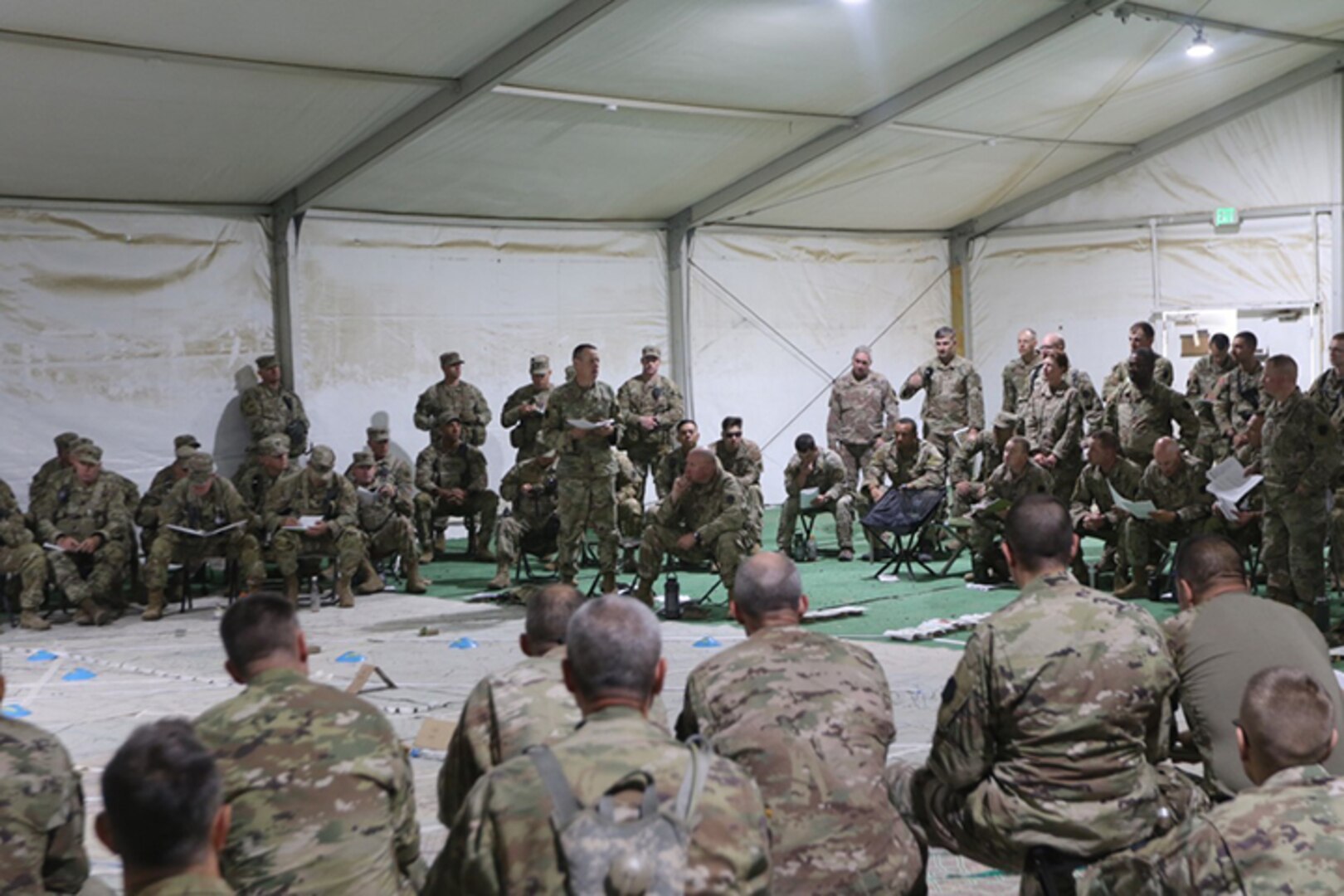 During the Independence Brigade’s National Training Center rotation 22-08, Col. Jon Farr, addresses key leadership, staff, and NTC-OCTs [Observer/Coach/Trainer] during a Combined Arms Rehearsal [CAR].