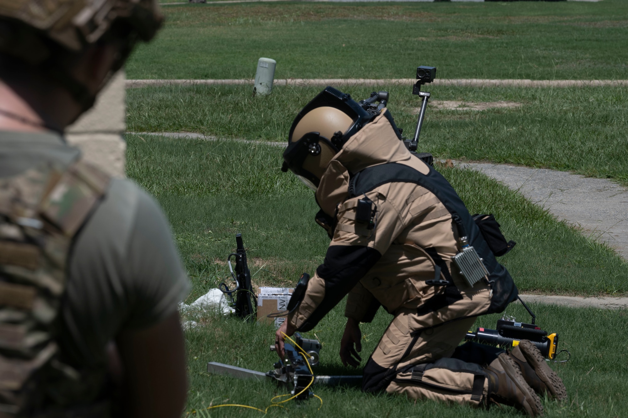 Airman 1st Class Nicholas Farrar, 4th CES EOD flight technician, prepares a percussion actuated neutralizer (PAN) during an exercise at Seymour Johnson Air Force Base, North Carolina, Aug. 4, 2022. The PAN was used to propel water into an improvised explosive device to neutralize the power supply, ensuring the IED does not detonate. (U.S. Air Force photo by Senior Airman Kevin Holloway)