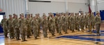 The 709th Medical Company Area Support stand at attention during the mobilization ceremony Aug. 6 at Monroe Elementary School in Peoria. Approximately 55 Soldiers from the unit will deploy in support of Operation Inherent Resolve to the U.S. Central Command area of responsibility.