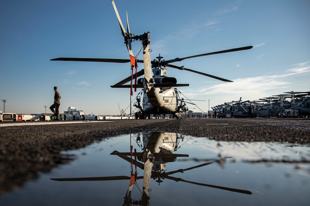 A U.S. Marine Corps UH-1Y Huey assigned to the Aviation Combat Element, 22nd Marine Expeditionary Unit, is secured on the flight deck as the Wasp-class amphibious assault ship USS Kearsarge (LHD 3) pulls into Helsinki, Finland, Aug. 5, 2022. The Kearsarge Amphibious Ready Group and embarked 22nd MEU, under the command and control of Task Force 61/2, is on a scheduled deployment in the U.S. Naval Forces Europe area of operations, employed by U.S. Sixth Fleet to defend U.S., allied and partner interests.