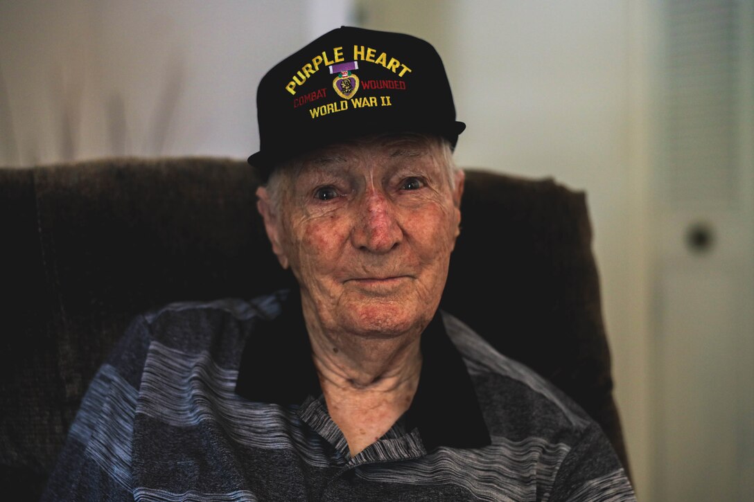 Richard Russell, a World War II Marine veteran, poses for a photo during an interview at his home in Phoenix, Arizona, July 23, 2022. Russell fought in the Battle of Guadalcanal during WWII, and turned 20 years old while fighting on the island. This year he will be celebrating his 100th birthday on the 80th anniversary of the battle.