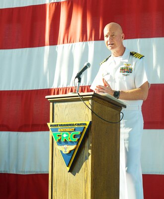 Capt. Grady Duffey, Fleet Readiness Center Southeast’s commanding officer, addresses the 2022 apprentice graduates and guests during a graduation ceremony onboard Naval Air Station Jacksonville. FRCSE launched the renewed apprenticeship program in 2019, a combination work-study program that provides apprentices with a competitive wage and benefits while learning a journey-level trade. (U.S. Navy Photo by Toiete Jackson/Released)