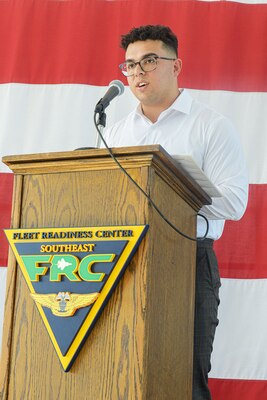 Gilbert Baez, a newly designated journey-level artisan with Fleet Readiness Center Southeast, addresses the audience after receiving his certificate of completion following a three year apprenticeship. Baez and his fellow classmates will be full-time employees with FRCSE and will be placed among the depot’s production lines as aircraft painters. (U.S. Navy Photo by Toiete Jackson/Released)