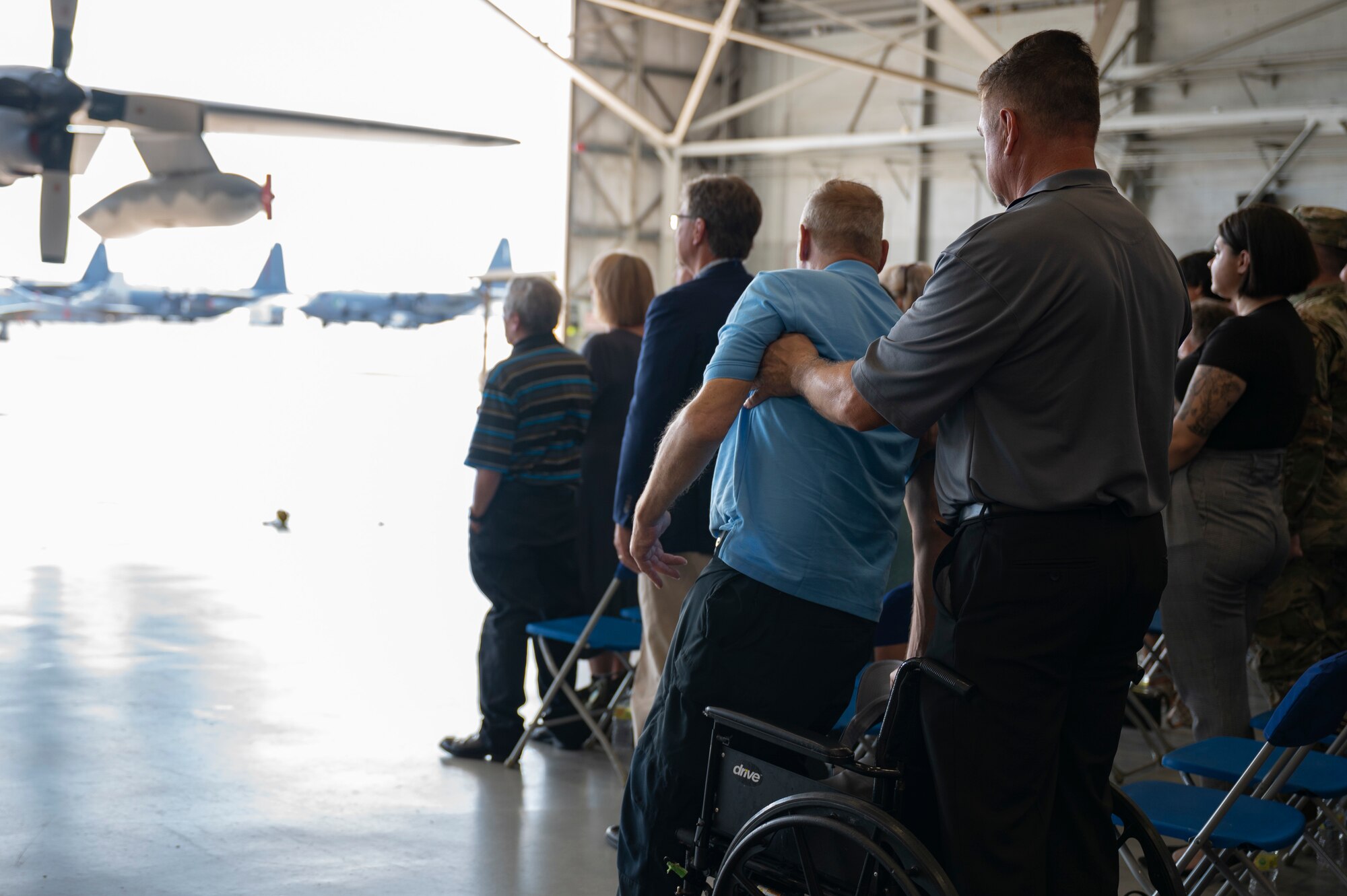 Air Commandos and families of the fallen Talon 13 aircrew members stand during the playing of “Taps” at a remembrance ceremony Aug. 5, 2022, at Hurlburt Field, Florida.