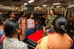 Lt. Kelly Chung, the legal officer aboard the Emory S. Land-class submarine tender USS Frank Cable (AS 40), speaks with students from St. Joseph’s College for Women during a tour of the ship while moored in Visakhapatnam, India, Aug. 2, 2022. Frank Cable is currently on patrol conducting expeditionary maintenance and logistics in the 7th Fleet area of operations in support of a free and open Indo-Pacific.