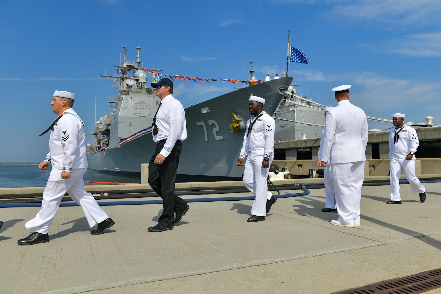 NAVAL STATION NORFOLK (Aug. 4, 2022) Sailors and former shipmates depart the guided-missile cruiser USS Vella Gulf (CG 72) during the ship’s decommissioning ceremony, Aug. 4, 2022. Vella Gulf was commissioned on Sept. 18, 1993 at Naval Station Norfolk. Vella Gulf is the first of five cruisers set to be decommissioned this year. (U.S. Navy photo by Mass Communication Specialist 1st Class Jacob Milham)