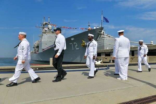 NAVAL STATION NORFOLK (Aug. 4, 2022) Sailors and former shipmates depart the guided-missile cruiser USS Vella Gulf (CG 72) during the ship’s decommissioning ceremony, Aug. 4, 2022. Vella Gulf was commissioned on Sept. 18, 1993 at Naval Station Norfolk. Vella Gulf is the first of five cruisers set to be decommissioned this year. (U.S. Navy photo by Mass Communication Specialist 1st Class Jacob Milham)