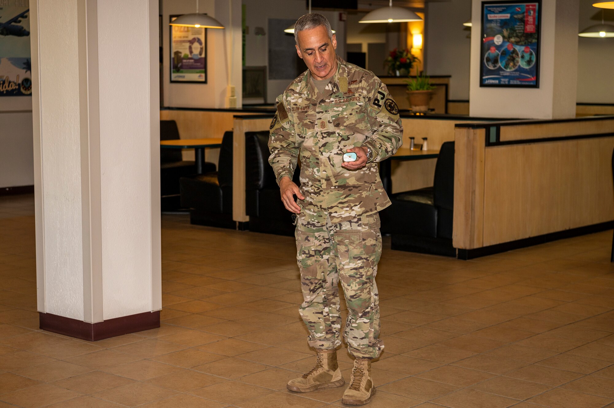 SEAC Ramón Colón-López, Senior Enlisted Advisor to the Chairman of the Joint Chiefs of Staff, explains the meaning of his coin to Airmen at the Reef Dining Facility Aug. 5, 2022 at Hurlburt Field, Florida. During his visit, the SEAC attended the Talon 13 Remembrance Ceremony, visited AFSOC Headquarters and 24th Special Operations Wing, had lunch with Airmen, and hosted an All-Call. The SEAC serves as the 4th Senior Enlisted Advisor to the Chairman of the Joint Chiefs of Staff, the most senior enlisted service member, by position, in the United States Armed Forces, and the principal military advisor to the Chairman on all matters involving joint and combined total force integration, utilization, health of the force, and joint development for enlisted personnel.