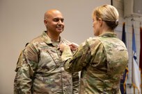 Col. Shahram Takmili receives the Legion of Merit from Brig. Gen. Charlene Dalto for meritorious service