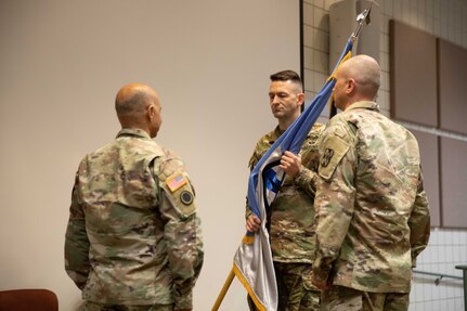 Col. Cody Strong receives the organizational colors from Brig. Gen. Charlene Dalto
