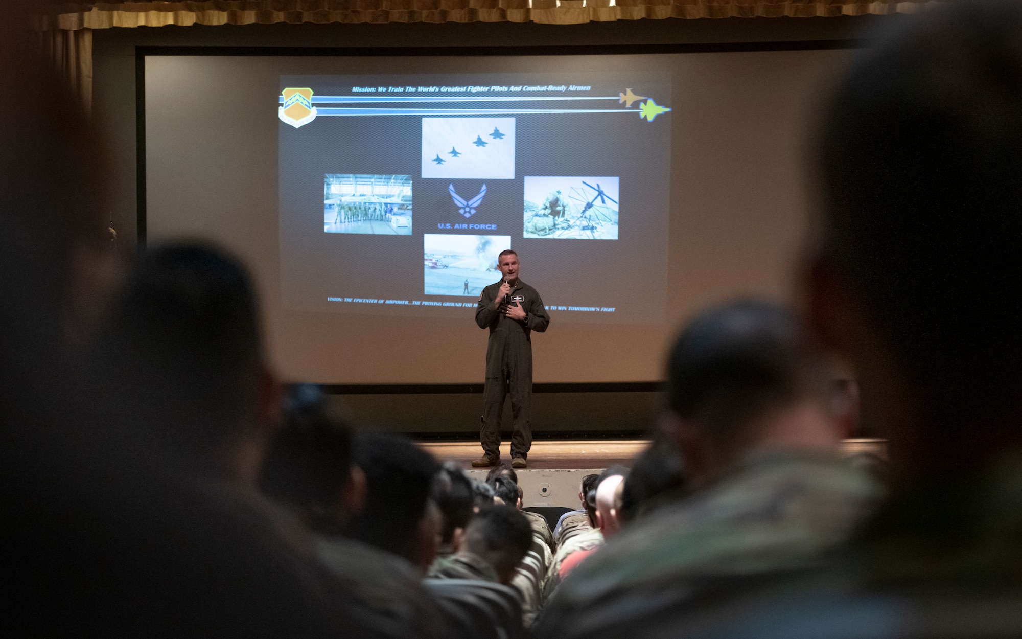 U.S. Air Force Brig. Gen. Jason M. Rueschhoff, 56th Fighter Wing commander, speaks to Airmen of the 56th FW, August 5, 2022, at Luke Air Force Base, Arizona.