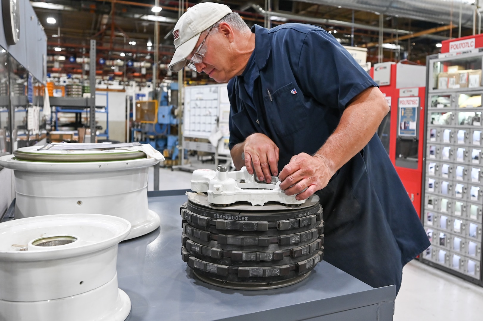 Greg Wilson, 309th Commodities Maintenance Group, inspects an F-15 brake.