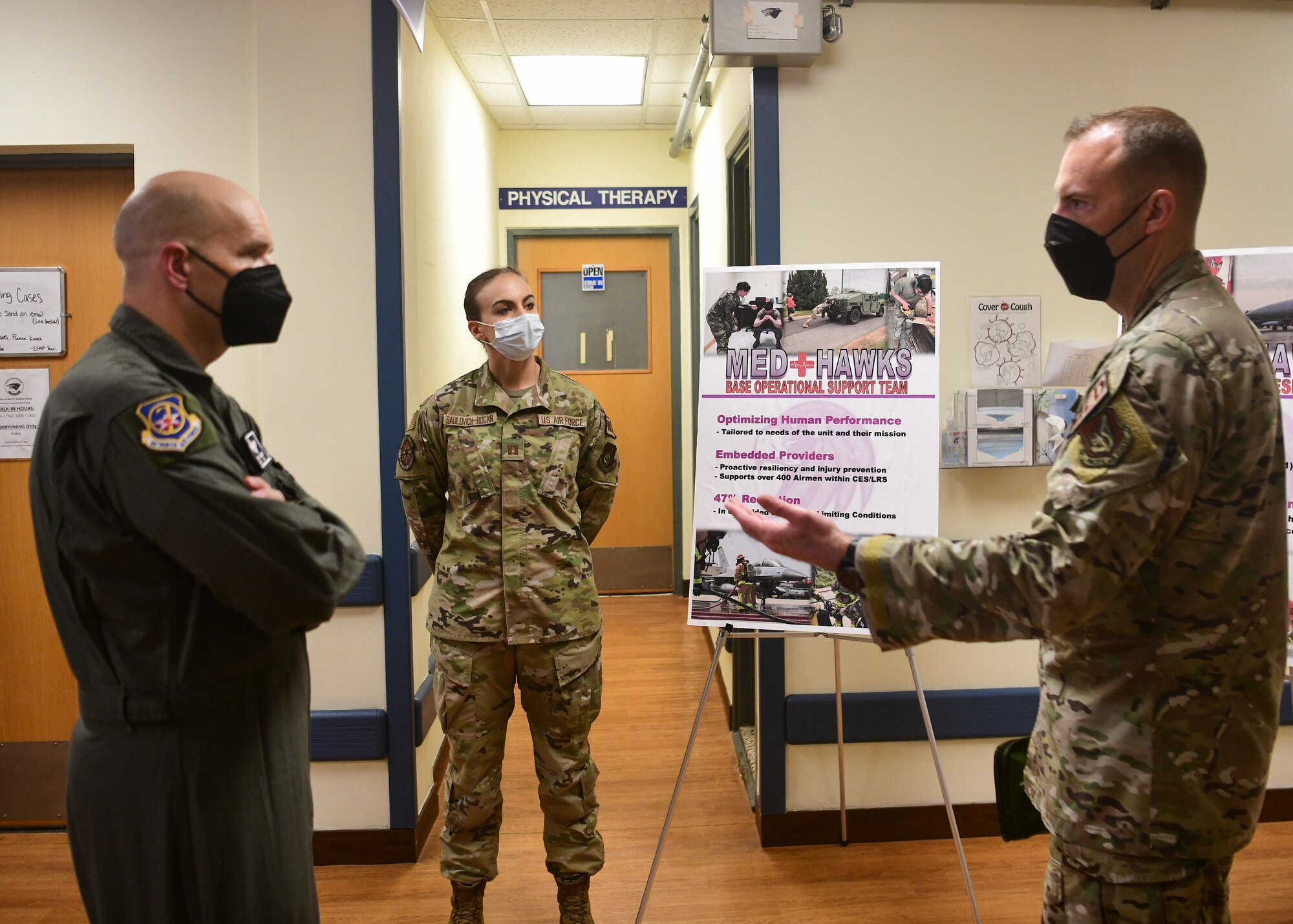 Military members brief each other.