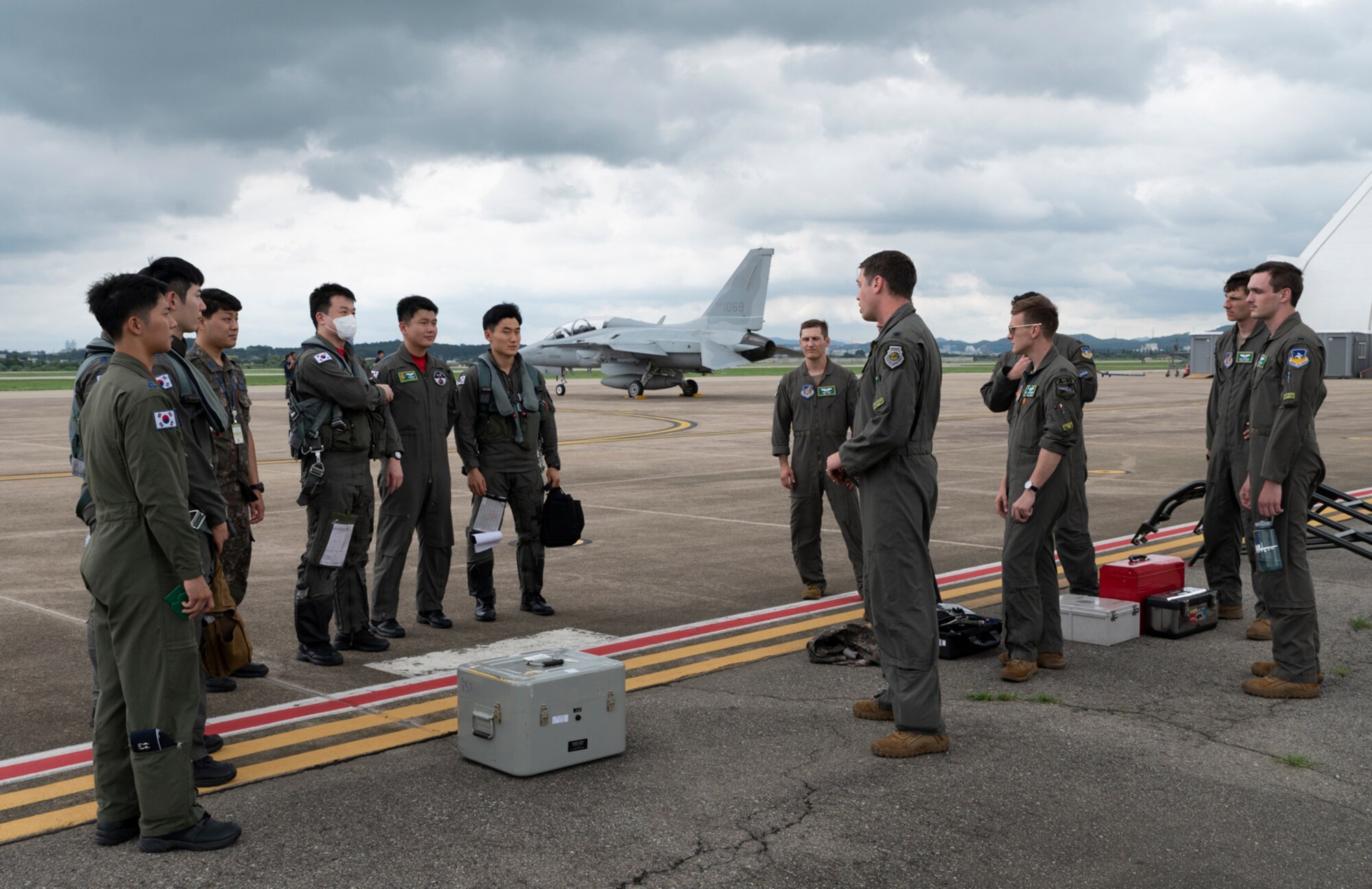 Republic of Korea Air Force pilots meet Airmen from the 25th Fighter Squadron after landing during Buddy Squadron 22 at Osan Air Base, Republic of Korea, Aug 2, 2022.