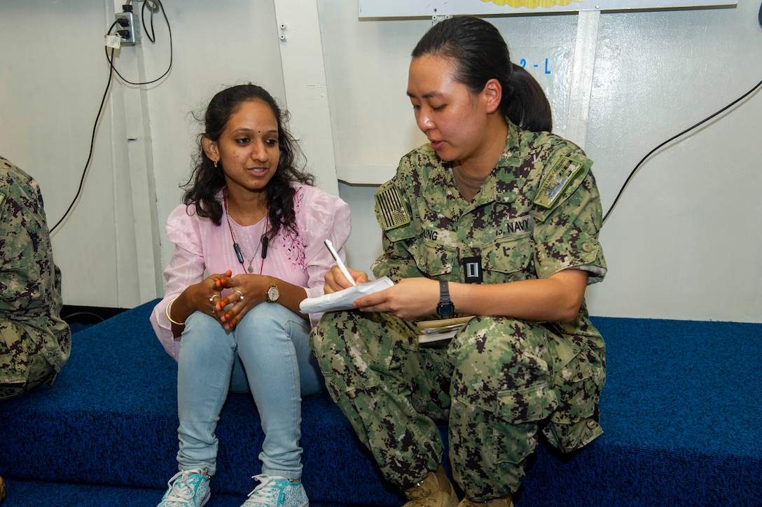 VISAKHAPATNAM, India (Aug. 2, 2022) – U.S. Navy Lt. Kelly Chung, the legal officer aboard the Emory S. Land-class submarine tender USS Frank Cable (AS 40), speaks with a student from St. Joseph’s College for Women during a tour of the ship while moored in Visakhapatnam, India on Aug. 2, 2022. Frank Cable is currently on patrol conducting expeditionary maintenance and logistics in the 7th Fleet area of operations in support of a free and open Indo-Pacific. (U.S. Navy photo by Mass Communication Specialist 2nd Class Kaitlyn E. Eads)