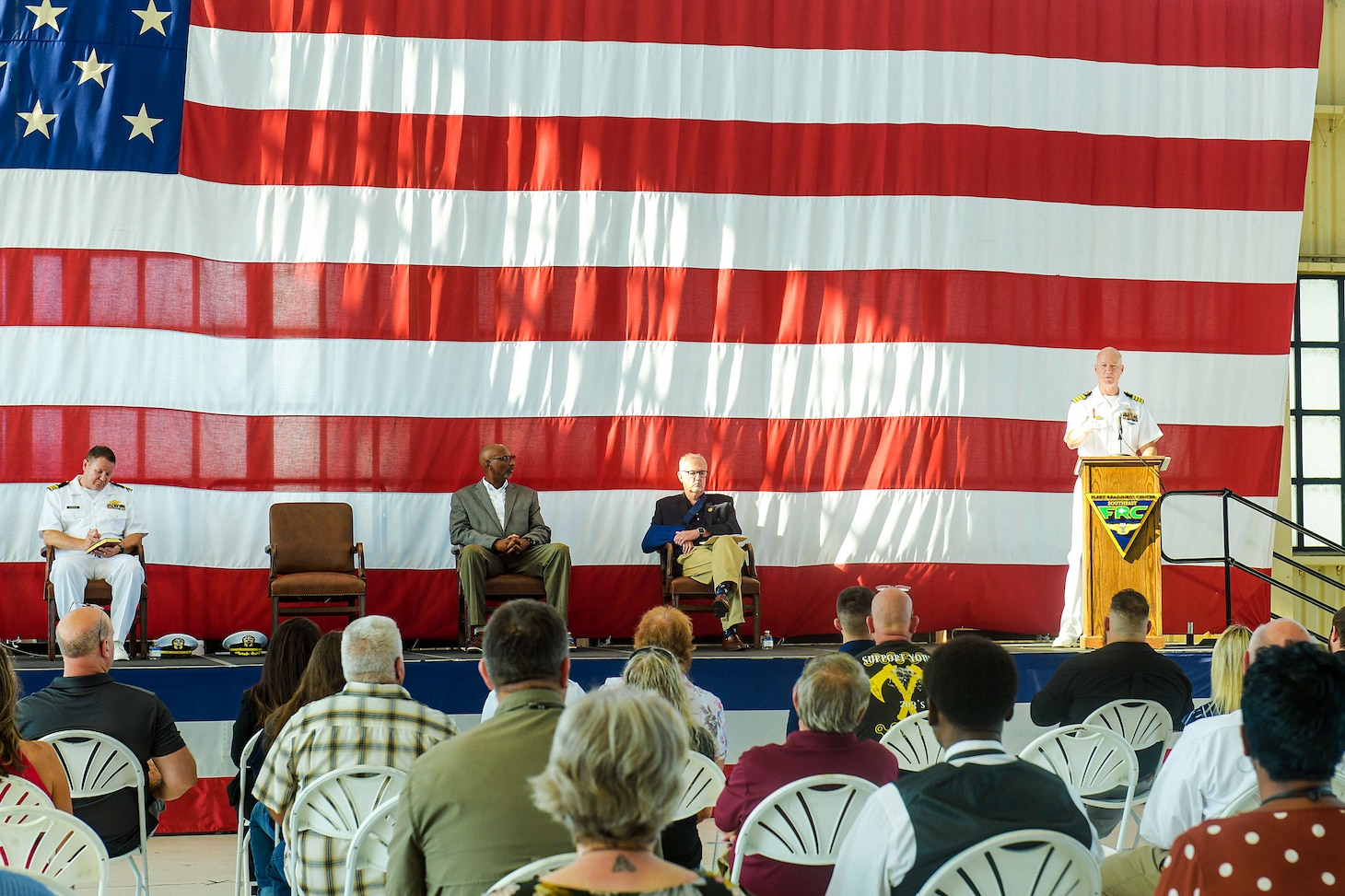 Capt. Grady Duffey, Fleet Readiness Center Southeast’s commanding officer, addresses the 2022 apprentice graduates and guests during a graduation ceremony onboard Naval Air Station Jacksonville. FRCSE launched the renewed apprenticeship program in 2019, a combination work-study program that provides apprentices with a competitive wage and benefits while learning a journey-level trade. (U.S. Navy Photo by Toiete Jackson/Released)