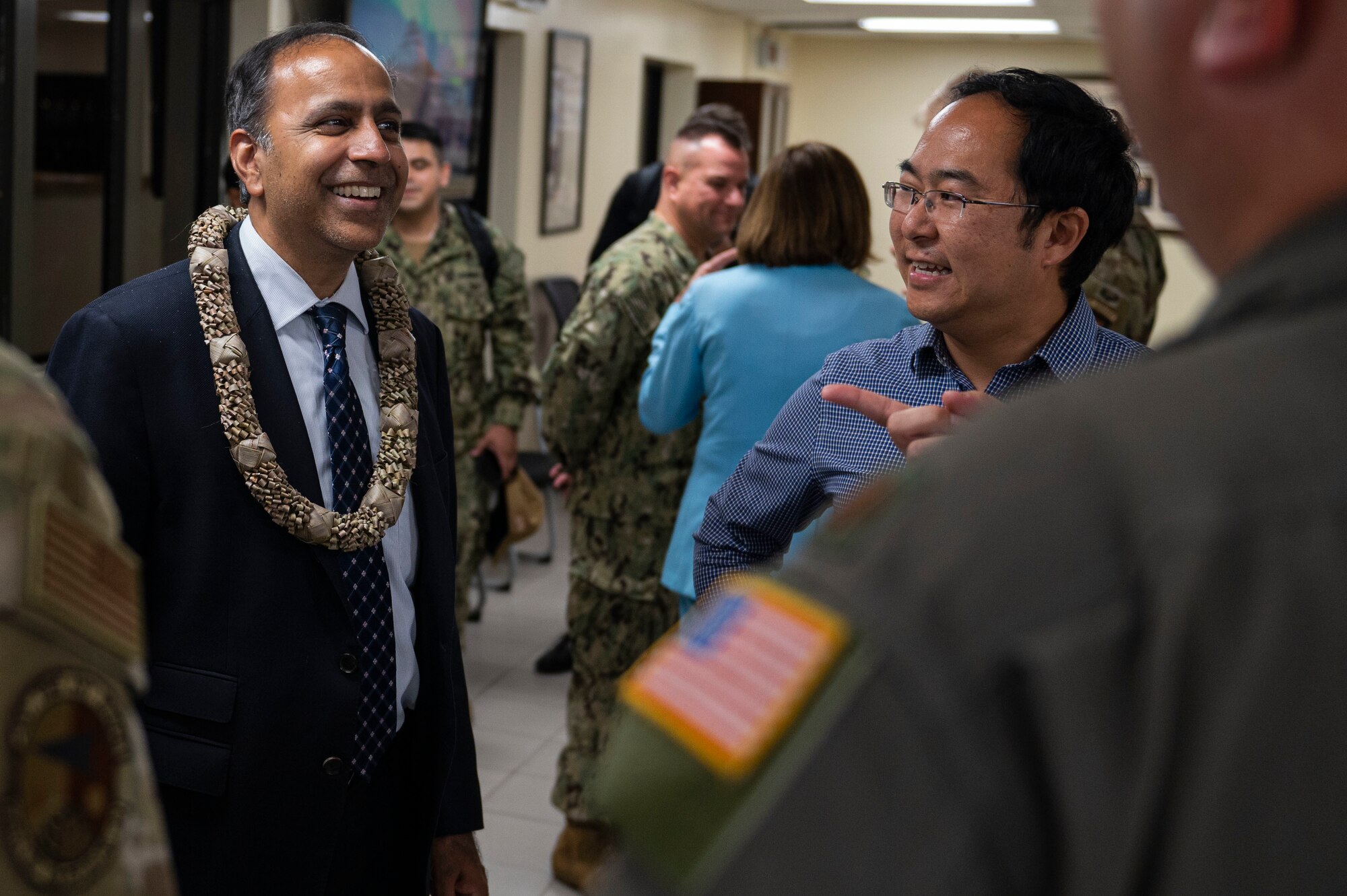 Representative Raja Krishnamoorthi and Representative Andy Kim speak with members of Team Andersen during a visit at Andersen Air Force Base, Guam, July 31, 2022. Krishnamoorthi and Kim accompanied Speaker of the U.S. House of Representatives Nancy Pelosi on a visit to Guam, which focused on bilateral relationships, security cooperation and climate change. (U.S. Air Force photo by Staff Sgt. Suzie Plotnikov)