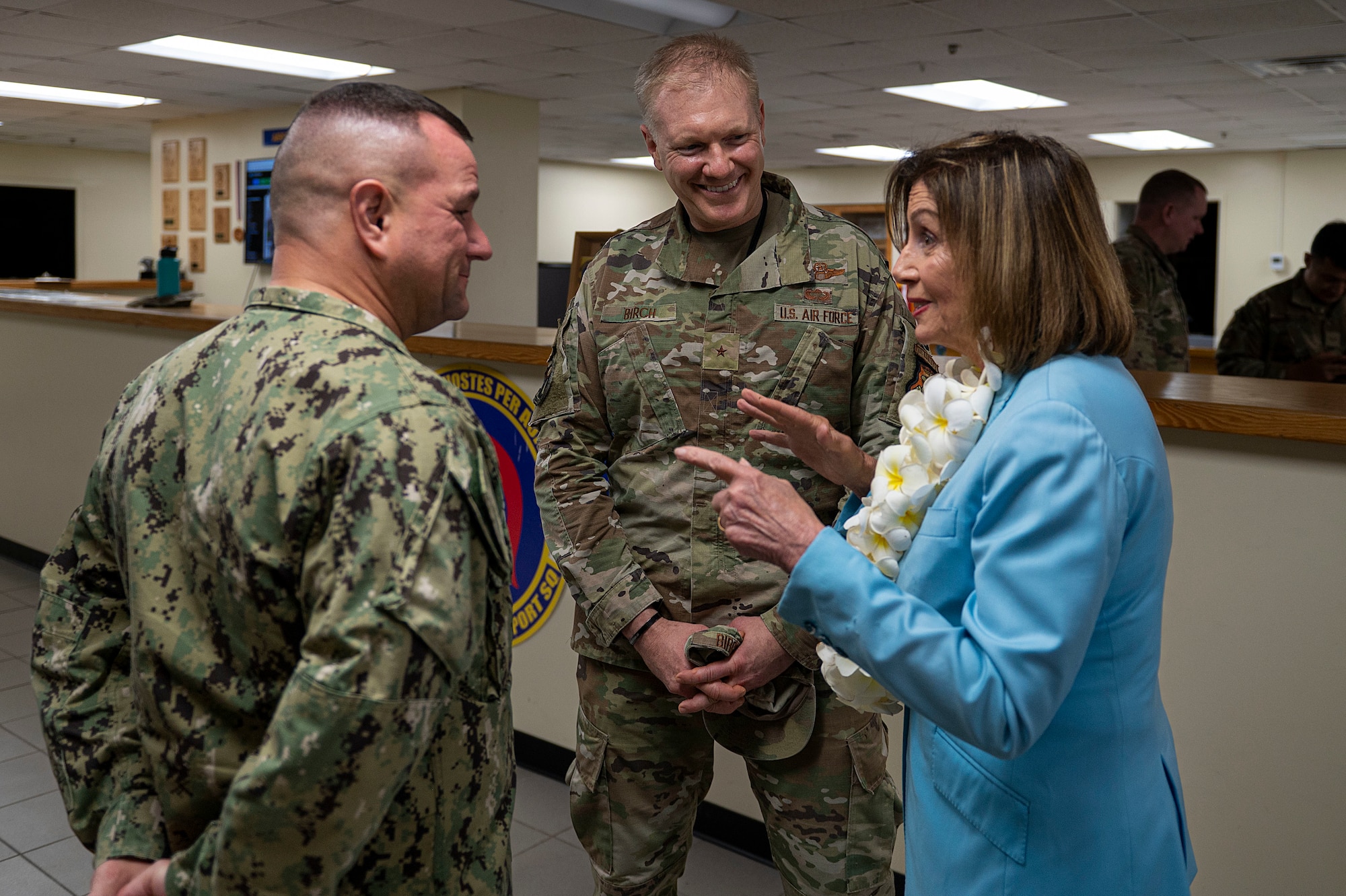 U.S. Navy Rear Adm. Benjamin Nicholson, Joint Region Marianas commander, and U.S. Air Force Brig. Gen. Paul Birch, 36th Wing commander, converse with Speaker of the U.S. House of Representatives Nancy Pelosi during a visit at Andersen Air Force Base, Guam, July 31, 2022. Pelosi’s visit focused on bilateral relationships, security cooperation and climate change. (U.S. Air Force photo by Staff Sgt. Suzie Plotnikov)