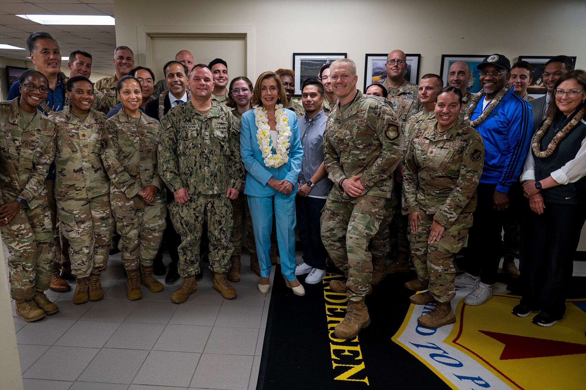 Congressional delegates take a group photo with Airmen, Sailors and Guardians during a visit at Andersen Air Force Base, Guam, July 31, 2022. Speaker of the U.S. House of Representatives Nancy Pelosi’s visit focused on bilateral relationships, security cooperation and climate change. (U.S. Air Force photo by Staff Sgt. Suzie Plotnikov)