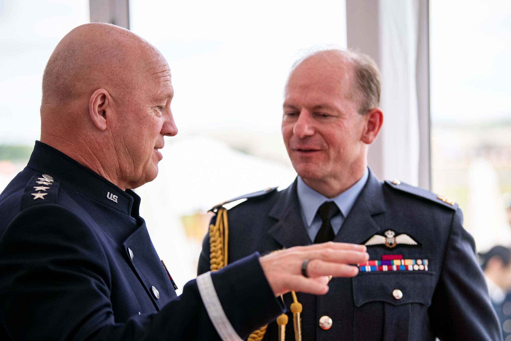 Gen. John W. “Jay” Raymond, left, Chief of Space Operations, speaks with Air Chief Marshal Sir Mike Wingston, Royal Air Force Chief of the Air Staff, during the Royal International Air Tattoo at RAF Fairford, England, July 15, 2022. Raymond attended RIAT to engage in bilateral meetings with other Air and Space Chiefs from other nations and demonstrate the Department of the Air Force’s commitment to its allies and partners. (U.S. Air Force photo by Staff Sgt. Eugene Oliver)