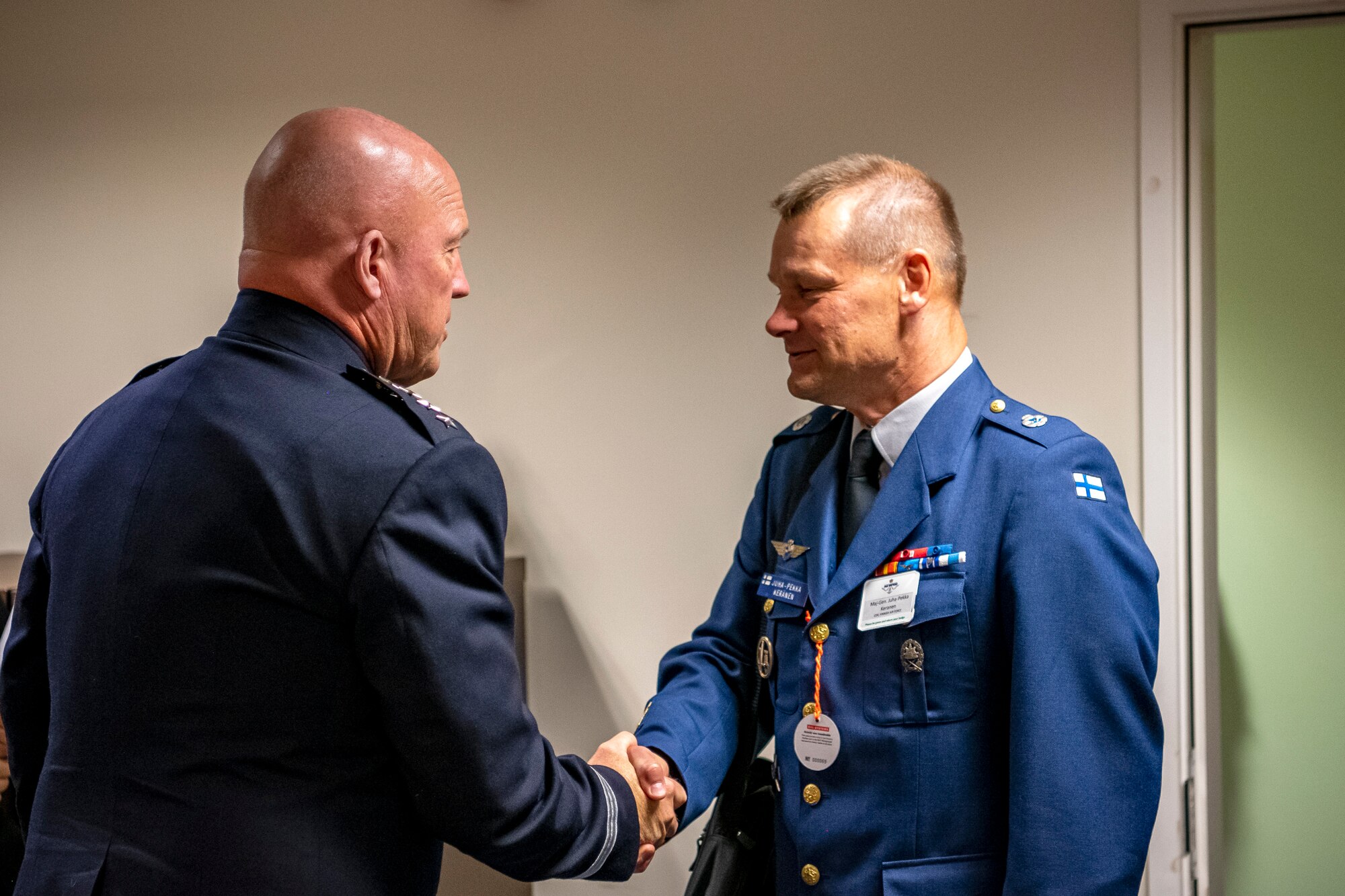 Gen. John W. “Jay” Raymond, left, Chief of Space Operations, shakes hands with Maj. Gen. Juha-Pekka Keränen, Finnish Air Forces Commander, during the Royal International Air Tattoo at RAF Fairford, England, July 15, 2022. Raymond attended RIAT to engage in bilateral meetings with other Air and Space Chiefs from other nations and demonstrate the Department of the Air Force’s commitment to its allies and partners. (U.S. Air Force photo by Staff Sgt. Eugene Oliver)