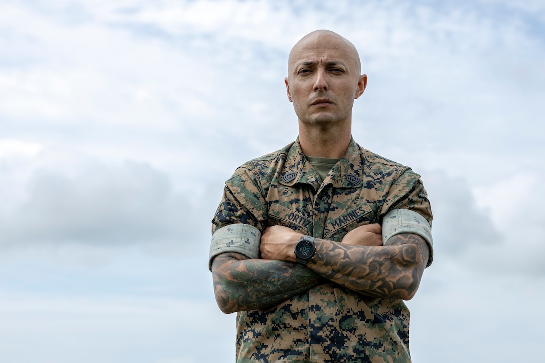 U.S. Marine Corps 1st Sgt. Jefferson Ortiz, company first sergeant for Air Operations Company, Marine Wing Support Squadron (MWSS) 271, poses for a photo at Marine Corps Auxiliary Landing Field Bogue, North Carolina, July 14, 2022. On May 13, 2022, Ortiz, a native of Miami, Florida, performed life-saving actions on a man who had been hit by a car. (U.S. Marine Corps photo by Chief Warrant Officer 2 Bryan Nygaard)