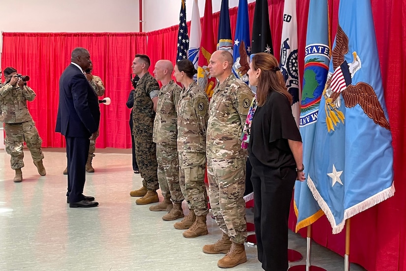 Secretary of Defense Lloyd J. Austin III meets with service members.