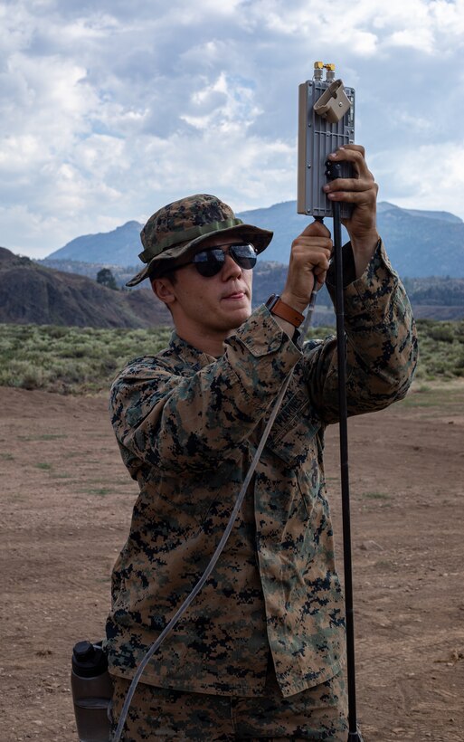 Cpl. Cole Millard, a Raven-B RQ-11 operator and intelligence specialist with H&S Company, 1st Battalion, 24th Marine Regiment, 4th Marine Division, Marine Forces Reserve, sets up a Raven-B RQ-11 Patch Antenna before launching an RQ-11 drone at Marine Corps Mountain Warfare Training Center, Bridgeport, Calif., July 27, 2022, for Mountain Training Exercise 4-22. MTX 4-22 allowed reserve Marines to participate in mountain warfare operations for realistic combat training to facilitate increased readiness for the Marine Forces Reserve. (U.S. Marine Corps photo by Cpl. Jonathan L. Gonzalez)