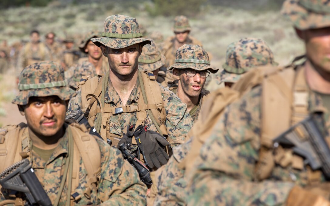 U.S. Marines with 1st Battalion, 24th Marine Regiment, 4th Marine Division, Marine Forces Reserve, hike back after finishing the final exercise for Mountain Training Exercise 4-22 at Marine Corps Mountain Warfare Training Center, Bridgeport, Calif., July 28, 2022. MTX 4-22 allowed reserve Marines to participate in mountain warfare operations for realistic combat training to facilitate increased readiness for the Marine Forces Reserve. (U.S. Marine Corps photo by Cpl. Jonathan L. Gonzalez)