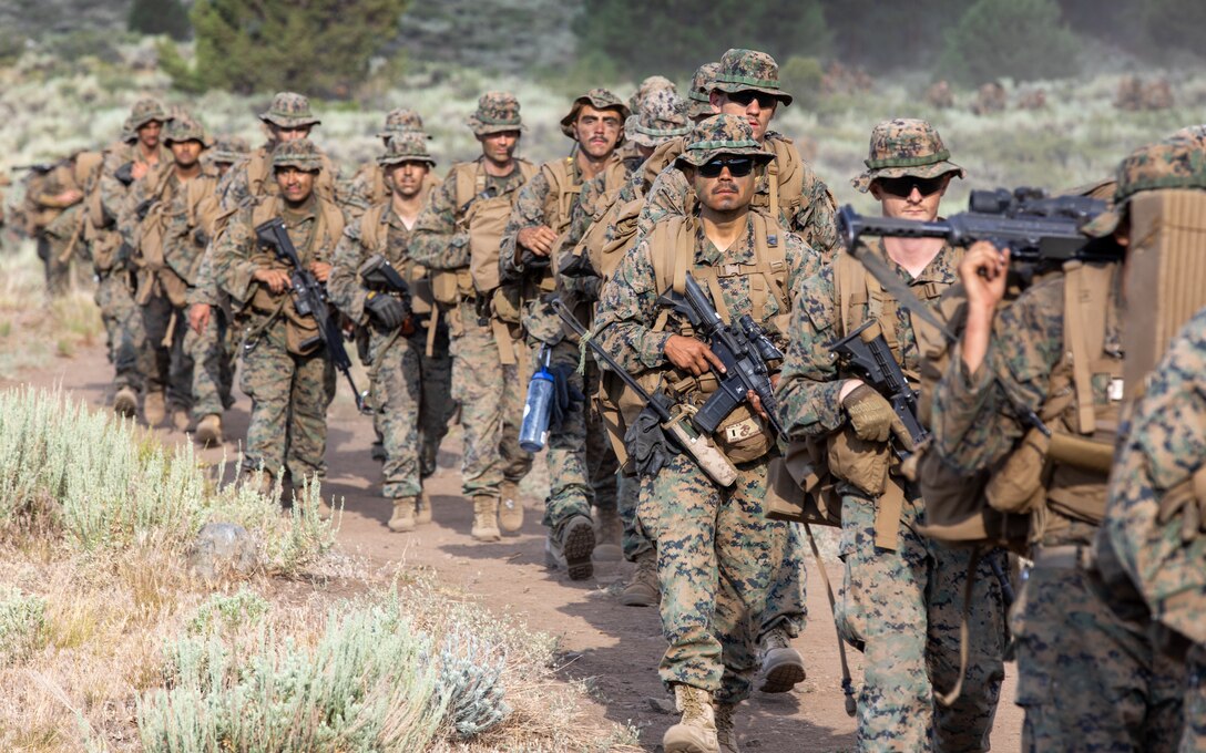 U.S. Marines with 1st Battalion, 24th Marine Regiment, 4th Marine Division, Marine Forces Reserve, hike back to lower base camp after finishing Mountain Training Exercise 4-22 at Marine Corps Mountain Warfare Training Center, Bridgeport, Calif., July 28, 2022. MTX 4-22 offers a unique training experience for reserve Marines to prepare and develop an understanding of traversing a mountainous environment as they maintain their readiness. (U.S. Marine Corps photo by Cpl. Jonathan L. Gonzalez)