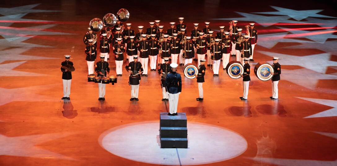 U.S. Marines with the Marine Forces Reserve (MFR) Band, perform at the Scope Arena for Virginia International Tattoo 2022 (VIT) at Norfolk, Virginia, April 28, 2022. The Virginia International Tattoo is a military tattoo that began in 1997 and is the signature event of the Virginia Arts Festival.  The tattoo showcases various military bands, massed pipes and drums, military drill teams, Celtic dancers, and choirs.