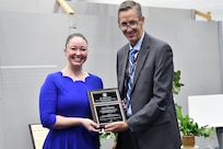 IMAGE: : Emily Johnson (pictured left), F/A-18 Human Factors Lead from Naval Air Weapons Station China Lake, was awarded the 2022 Naval Laboratory and Centers Coordinating Group G. Dennis White Early Career Human Systems Integration Practitioner Award from Dr. Brett Seidle (pictured right), SES, Deputy Assistant Secretary of the Navy Research, Development, Test, and Engineering.