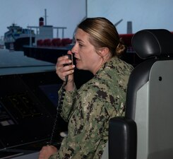 NEWPORT, R.I. (Aug. 1, 2022) Cmdr. Angela Eickelmann, a student at Surface Warfare Schools Command (SWSC) in Newport, Rhode Island, acts as junior officer of the deck during a ship driving simulation in the littoral combat ship bridge part-task trainer, Aug. 1, 2022. SWSC provides a continuum of professional education and training to ready sea-bound warriors to serve on surface combatants as officers, enlisted engineers, and enlisted navigation professionals. (U.S. Navy photo by Mass Communication Specialist 2nd Class Derien C. Luce)