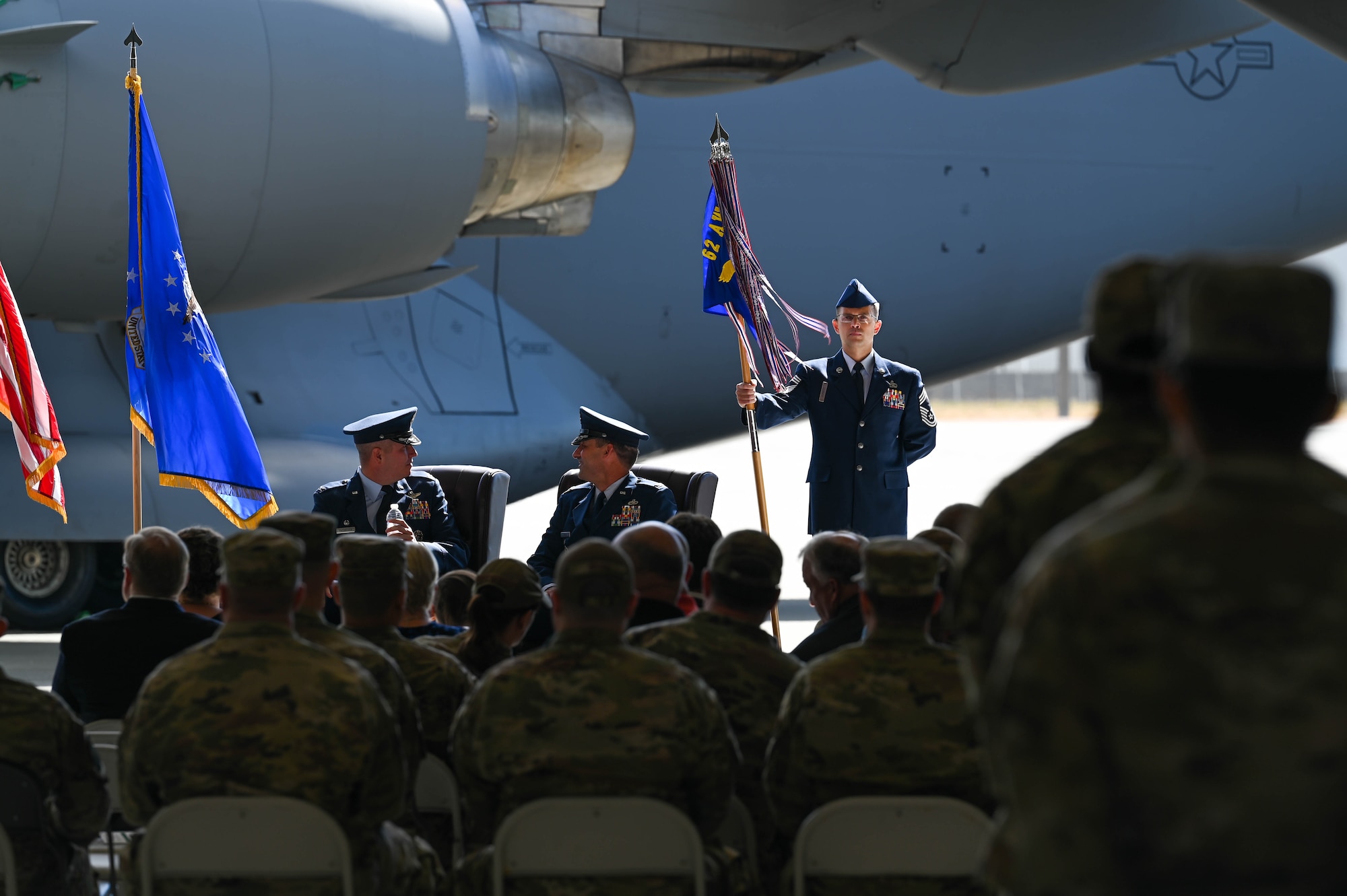U.S. Air Force Col. David Fazenbaker, left, commander of the 62d Airlift Wing, and Col. Christopher Joyce, incoming commander of the 62d Maintenance Group, share words during an assumption of command ceremony at Joint Base Lewis-McChord, Washington, Aug. 5, 2022. The 62d MXG provides cargo, passenger, and aerial delivery for Joint Base Lewis-McChord’s power projection platform, to include operating the Air Mobility Command Passenger Terminal at Seattle-Tacoma International Airport. (U.S. Air Force photo by Airman 1st Colleen Anthony)