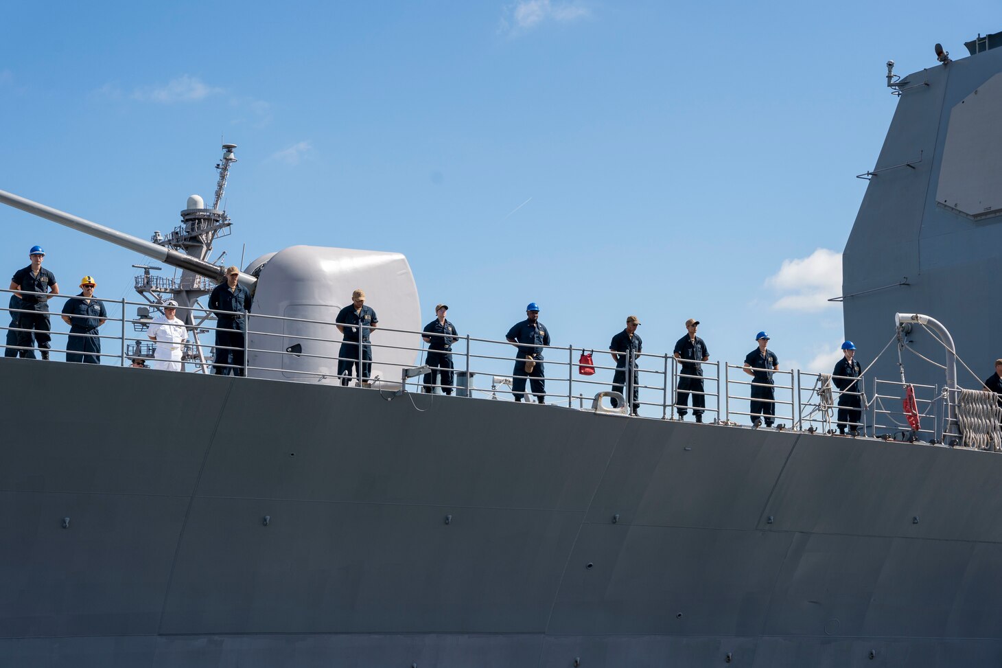 Sailors man the rails as the Ticonderoga-class guided-missile cruiser USS Leyte Gulf (CG 55) departs Naval Station Norfolk.