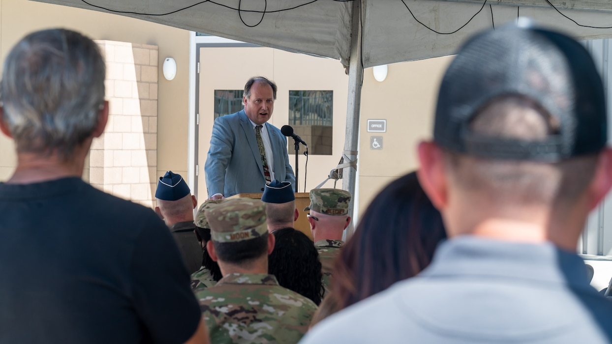 Patrick O'Brien, Office of Local Defense Community Cooperation Director, provides his remarks during the ribbon cutting event for Desert Jr./Sr. High School on Edwards Air Force Base, California, Aug. 9. (Air Force photo by Giancarlo Casem)