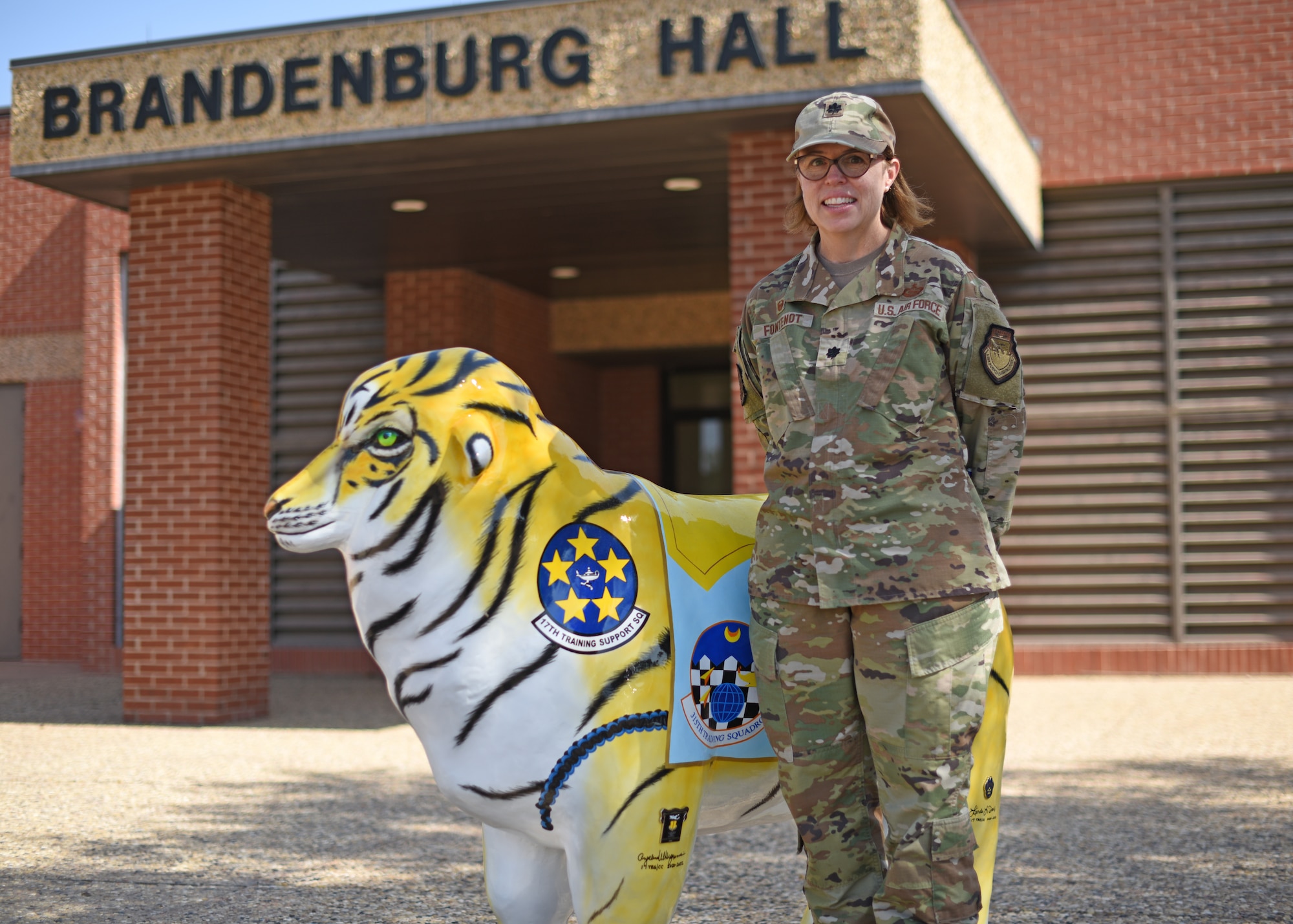 U.S. Air Force Lt. Col. Renee Fontenot, 17th Training Support Squadron commander, poses for a photo next to ‘Training Ewe’ outside of the 17th Training Support Squadron building, Goodfellow Air Force Base, Texas, August 5, 2022. Fontenot graduated from Louisiana State University and is excited to be back at Goodfellow AFB to support the training mission. (U.S. Air Force photo by Airman 1st Class Zachary Heimbuch)