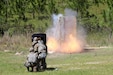 U.S. Army Reserve Soldiers, assigned to the 344th Engineer Company based in Tallahassee, Florida, take cover behind a blast blanket while detonating a linear det charge placed on a door hinge to create an entry point during the Pershing Strike mobilization exercise.