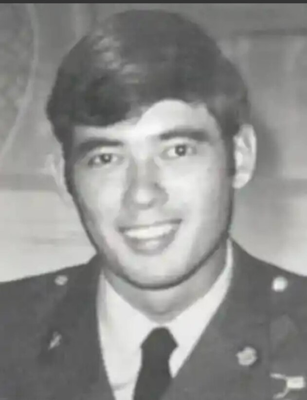 A man smiles at the camera.