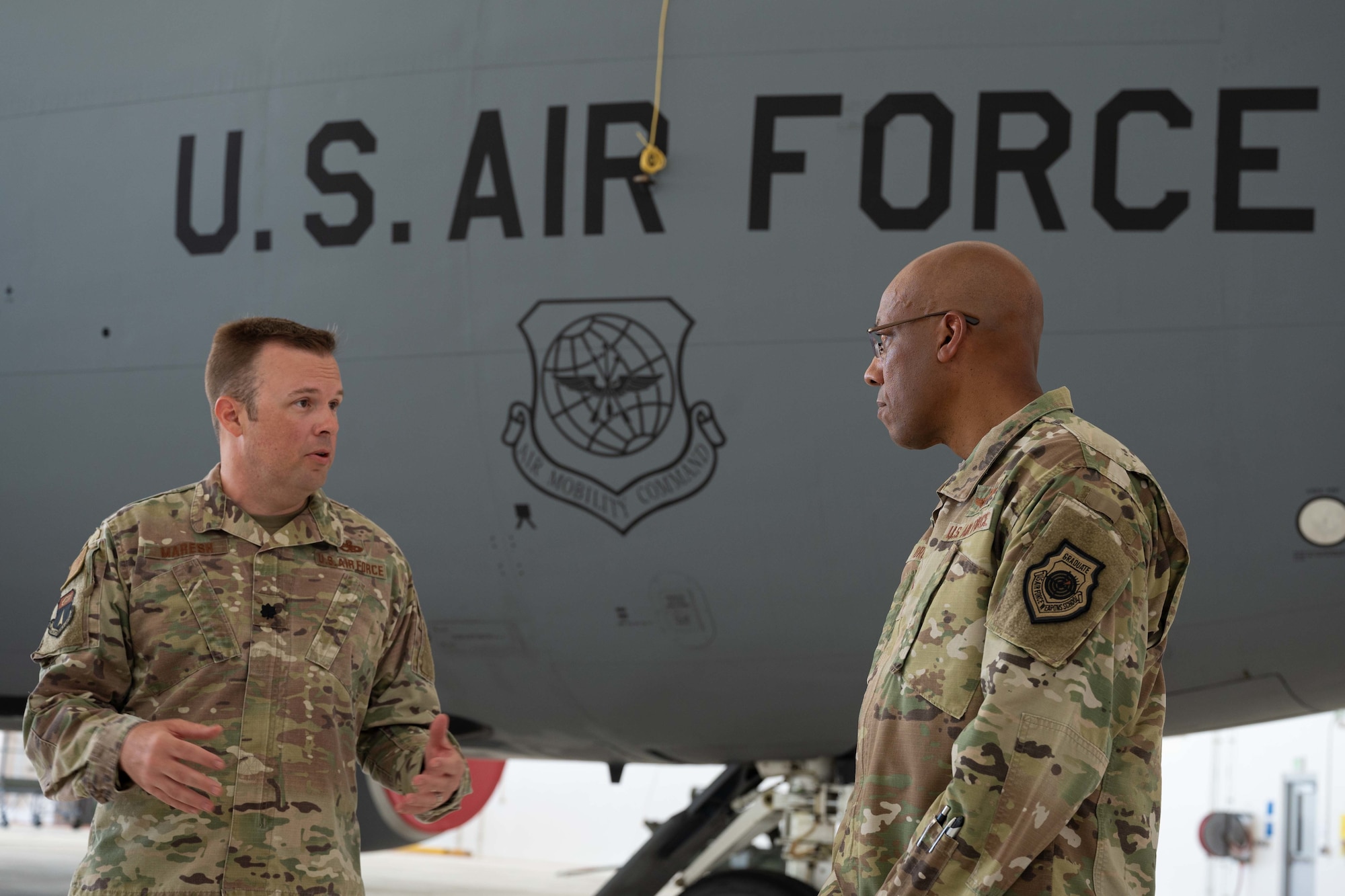 U.S. Air Force Chief of Staff Gen. CQ Brown, Jr. talks with Lt. Col. Nathan Maresh, 36th Maintenance Group deputy commander, about a new hangar finished earlier this year and the importance of strong international partnerships at Andersen Air Force Base, Guam, Aug. 7, 2022.