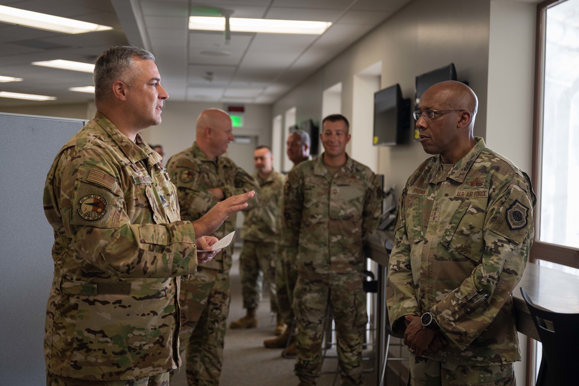 U.S. Air Force Chief of Staff Gen. CQ Brown, Jr. talks with Tanker Task Force leadership about a new hangar finished earlier this year and the importance of strong international partnerships at Andersen Air Force Base, Guam, Aug. 7, 2022.