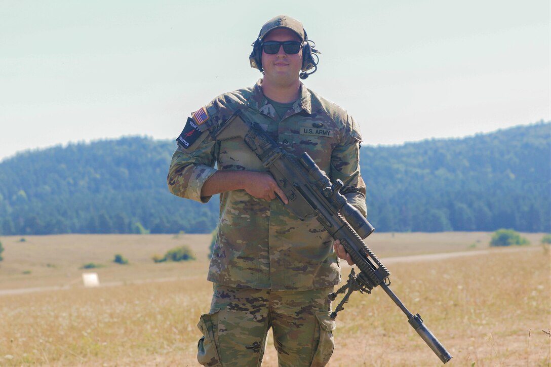 Sgt. Dalton Weist of 1st Battalion, 109th Infantry Regiment, 2nd Infantry Brigade Combat Team poses for a photo during the European Best Sniper Competition at Hohenfels Training Area, Germany, Aug. 5, 2022.