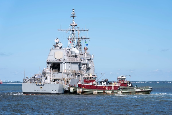 Sailors man the rails as the Ticonderoga-class guided-missile cruiser USS Leyte Gulf (CG 55) departs Naval Station Norfolk, Aug. 8. Leyte Gulf, assigned to the George H.W. Bush Carrier Strike Group, departed Naval Station Norfolk on a scheduled deployment in support of naval operations to maintain maritime stability and security in order to ensure access, deter aggression and defend U.S., allied and partner interests.