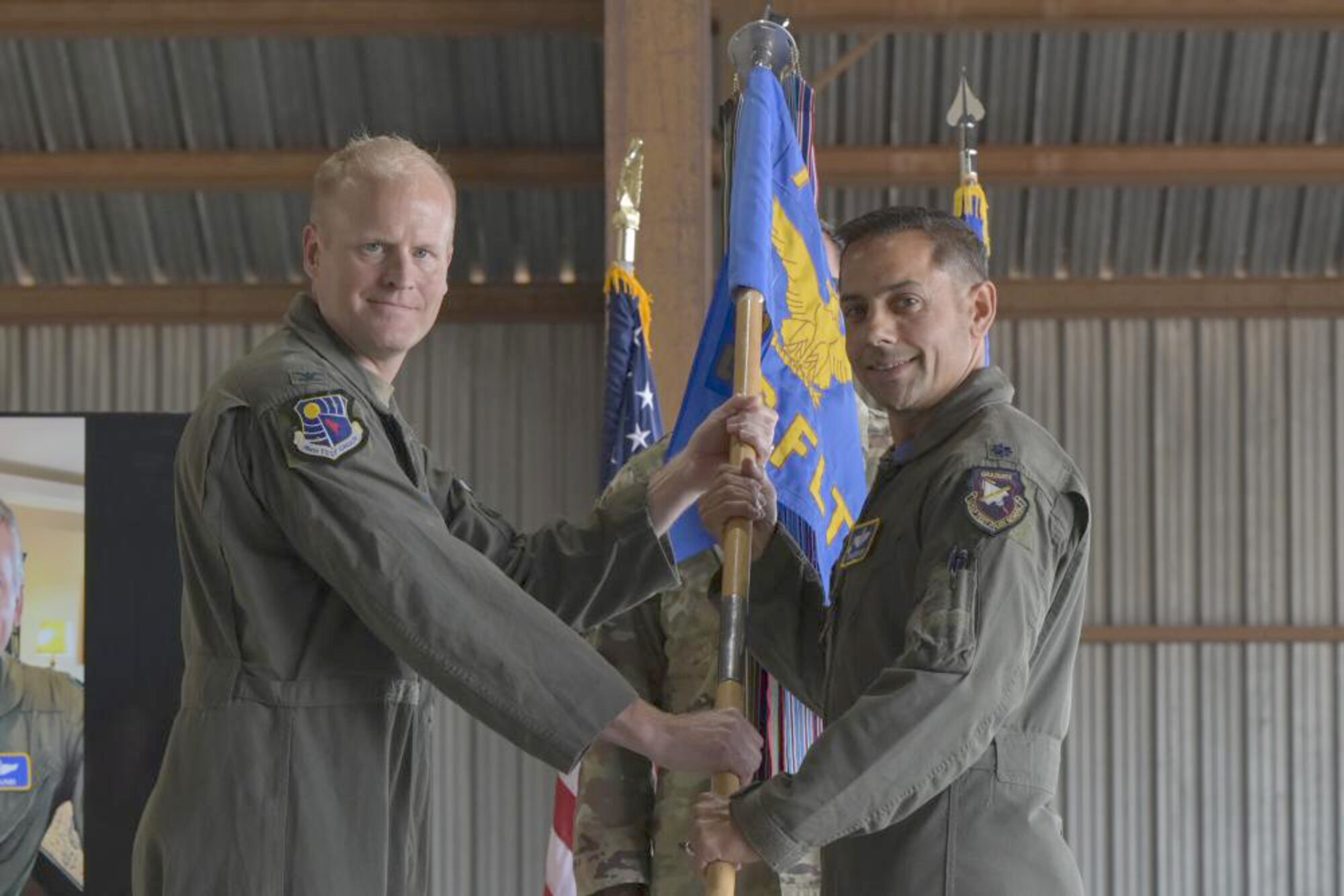 Lt. Col. Sean Siddiqui, right, takes command of the 586th Flight Test Squadron from Col. Darren Wees, 704th Test Group commander, on Holloman Air Force Base, New Mexico July 15, 2022. The 586th FLTS plans, analyzes, coordinates and conducts flight tests of advanced weapons and avionics systems primarily on the White Sands Missile Range. (U.S. Air Force photo by Airman 1st Class Antonio Salfran)