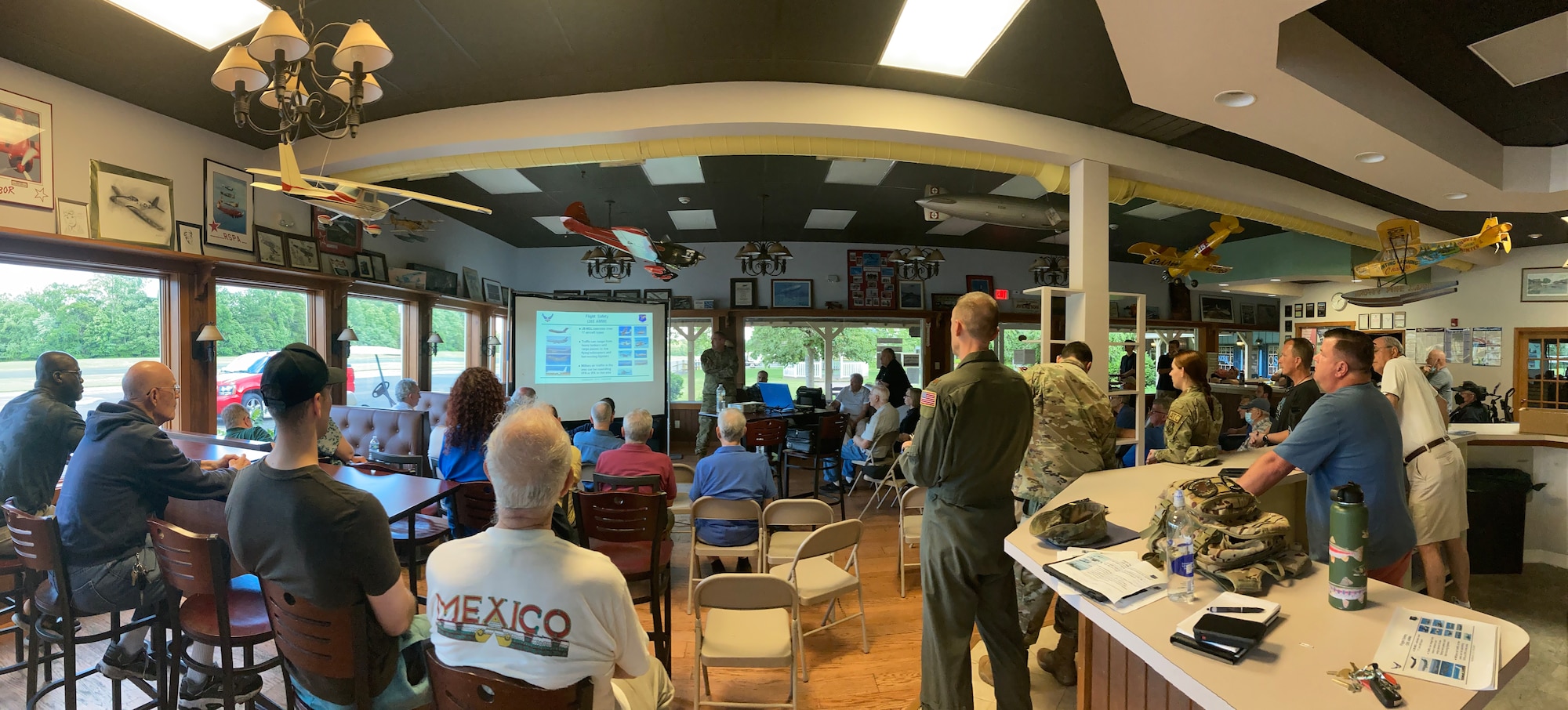 U.S. Air Force Airman assigned to the 305th Air Mobility Wing gives presentation about the Mid-Air Collision Avoidance program.