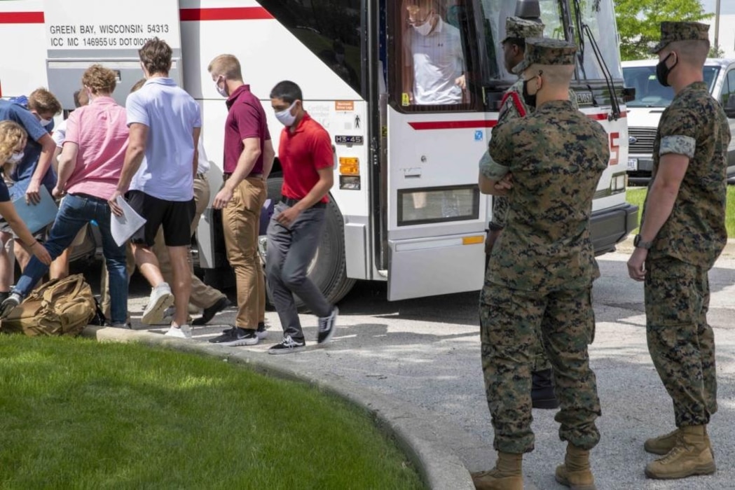 220610-N-PW480-0344 GREAT LAKES, Ill. (June 10, 2022) – Naval Reserve Officers Training Corps (NROTC) New Student Indoctrination (NSI) midshipman candidates exit a bus upon arrival at Recruit Training Command (RTC), June 10. Upon completion of NSI, the candidates will start their freshman year of the NROTC program at colleges and universities nationwide this fall. NSI is an indoctrination program hosted at RTC, and provides midshipmen with a common military training orientation. NSI provides basic training in five warfighting fundamentals – firefighting, damage control, seamanship, watchstanding and small arms handling and marksmanship – to begin creating basically trained and smartly disciplined future Navy and Marine Corps officers. NROTC is overseen by Commander, Naval Service Training Command (NSTC), Rear Adm. Jennifer S. Couture, which supports naval accessions training for 98 percent of the Navy’s new officers and enlisted Sailors. (U.S. Navy photo by Mass Communication Specialist 2nd Class Nikita Custer)